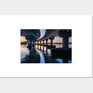 Curving lines and calm water under Tauranga Harbour Bridge at sunrise. Posters and Art